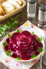 Festive salad an appetizer in the form of rose (from beetroot, e