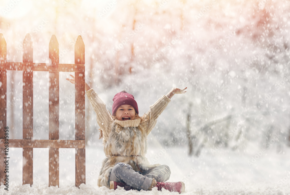 Poster girl playing on a winter walk