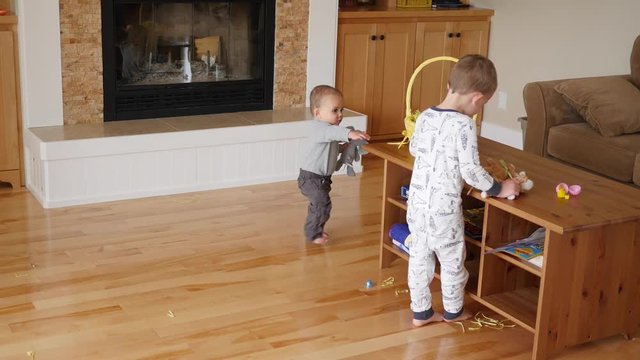 Two boys looking for easter eggs in home
