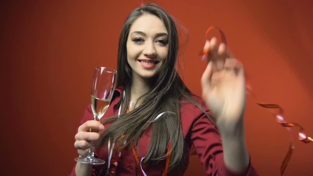 a new year party brunette girl having fun with bocal of champaign
