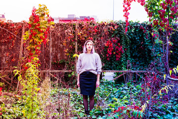 Young beautiful caucasian purple grey hair woman outdoor in the city posing on abandoned place with...