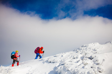 Naklejka na ściany i meble Climbers are on snow slope.