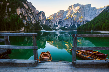 Boats on the Braies Lake ( Pragser Wildsee ) in Dolomites mounta