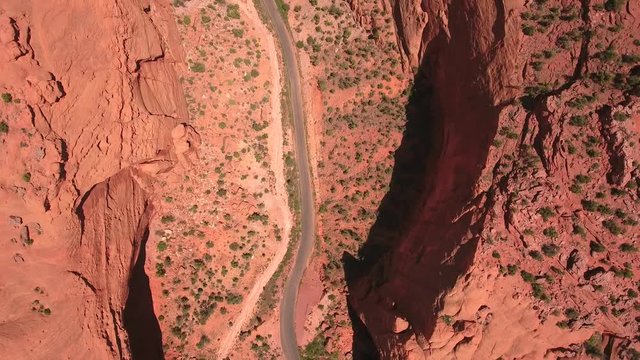 An aerial shot of amazing road in beautiful desert burr trail canyon