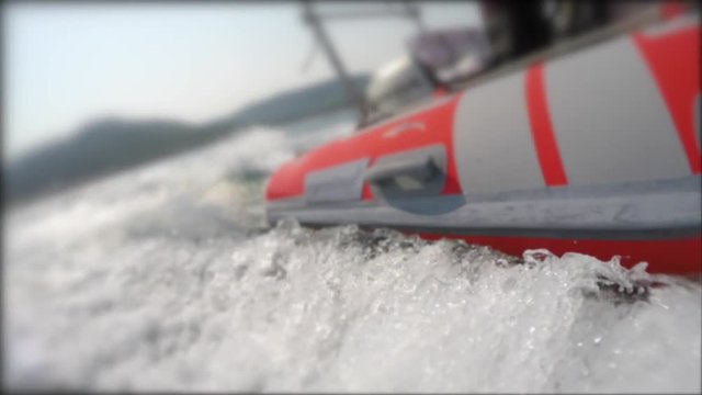 A small raft cruising across a rough ocean