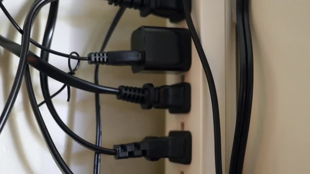 Tons of plugs and cables in surge protector