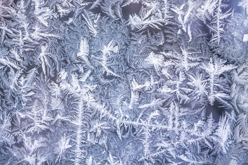 Abstract winter pattern on frosted window as Christmas background 