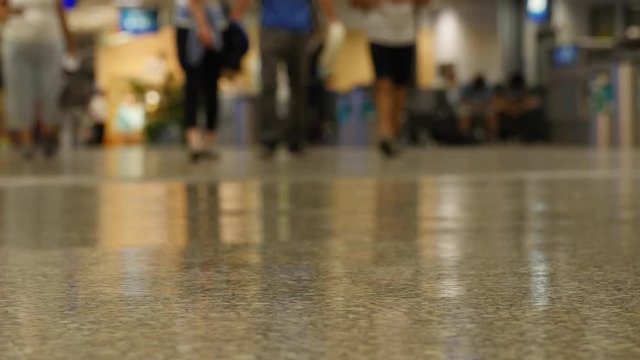 Crowds walking through the airport at night