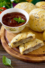 Pies fried samosa on a wooden table, the national dish of Caucas