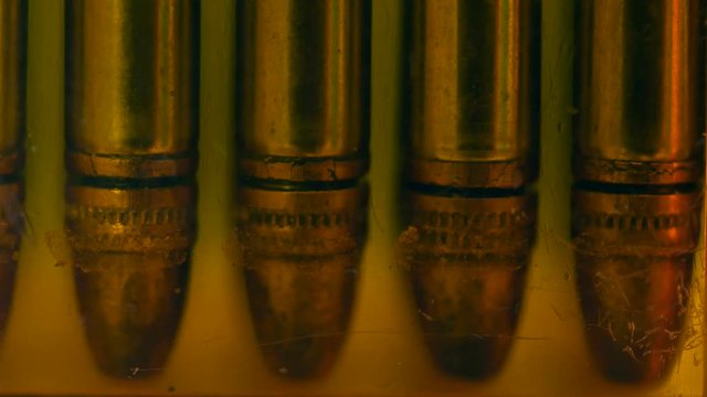 Dolly shot of bullets in a case