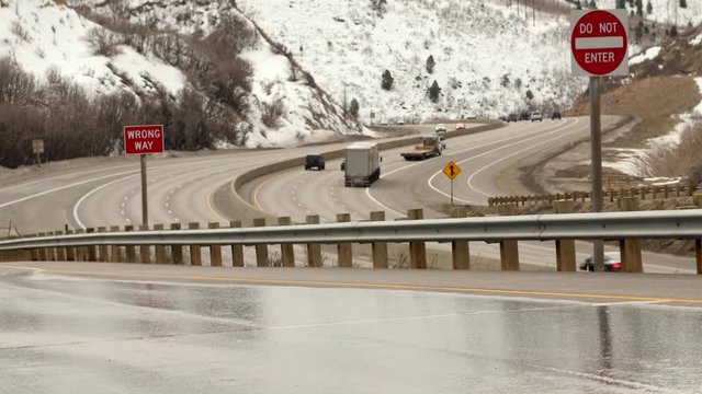 Trucks and cars drive on I-80 highway