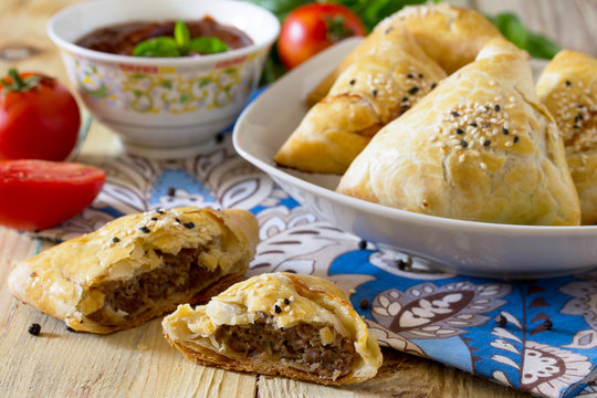 Fried pies with meat, samsa and tomato ketchup, the national dis