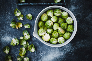 Raw Brussels Sprouts In Ceramics Bowl.