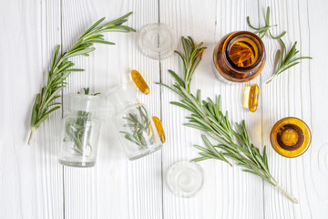 Fototapeta na wymiar natural medicine - herbs on wooden table top view