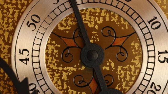 Closeup dolly shot of the second hand on a grandfather clock