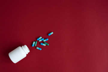 blue tablets in plastic container top view
