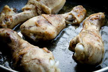 chicken legs in the pan
