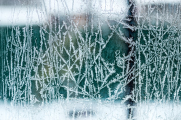 Frosty pattern on glass. Christmas and New Year's texture.