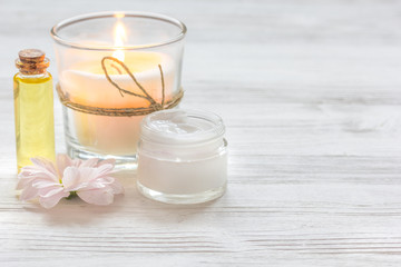 Obraz na płótnie Canvas spa nail care with aroma candle on wooden background