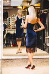 Woman making selfie in front of the mirror