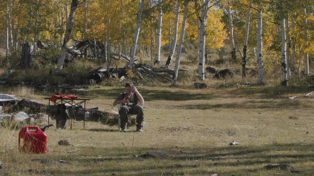 Man camping on an elk hunt