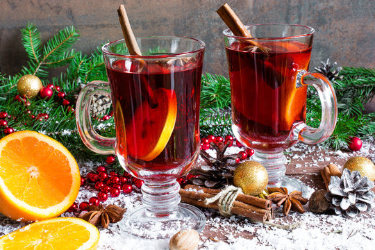 christmas mulled wine with cinnamon sticks, anise and orange
