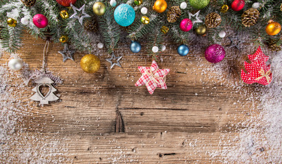 Christmas crafted decoration on wooden background.