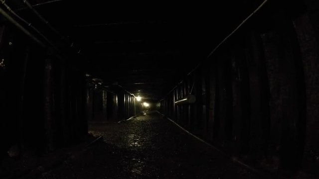 Camera jib shot through a dark coal mine at glace bay