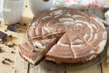 Chocolate cake ice cream zebra on a wooden background.