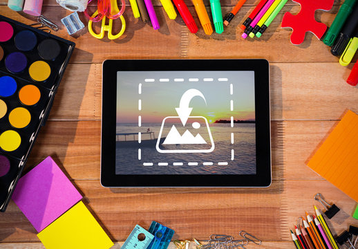 Tablet and Basic Art Supplies on Table Mockup