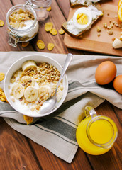 healthy breakfast bowl of yogurt with granola and eggs