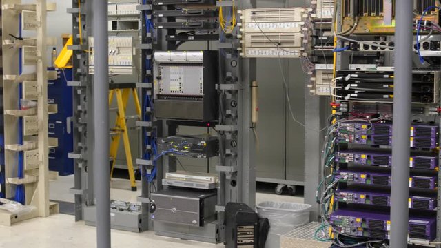 Panning shot telecommuniations room with servers
