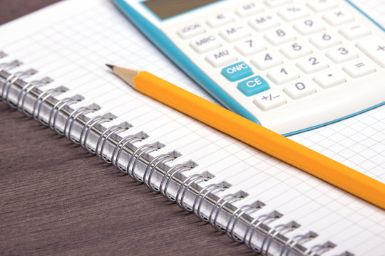 Book notebook, pencil and calculator
