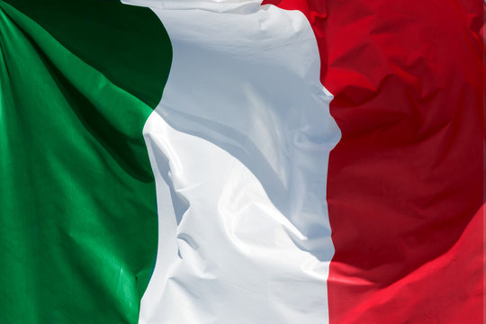 full framed italian flag floating in the wind exact colors