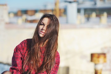 Obraz premium A wonderful portrait of a beautiful young girl with long gorgeous hair, close-up.