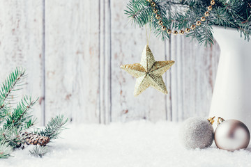 Composition with Christmas decorations in vase on wooden backgro