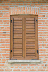 window closed with wooden exterior shutters
