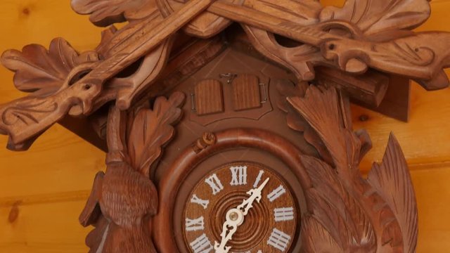 Beautiful hand carved cuckoo clock on a wall
