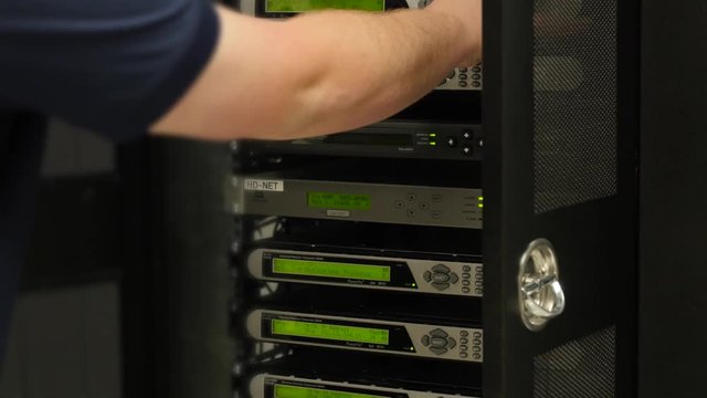 Tech works in the telecommunications server room