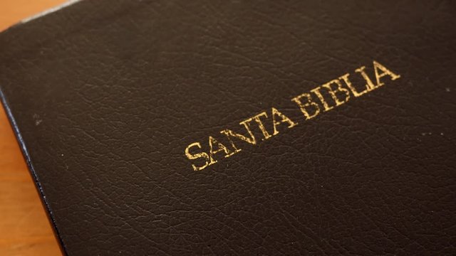 Closeup dolly shot of spanish bible