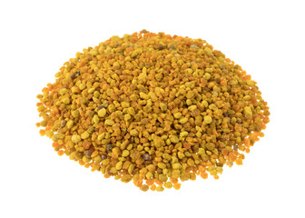 Bee pollen granules on a white background.