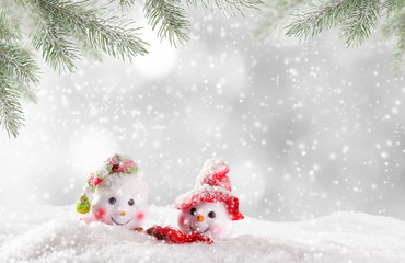 Christmas snowmen on abstract background