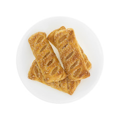 Apple fruit tarts on a plate top view isolated on a white background.