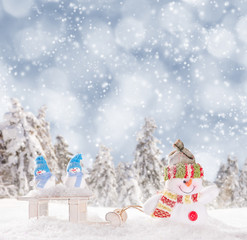 Christmas snowmen on abstract background