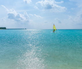 A man with a Board for Windsurfing, Maldives