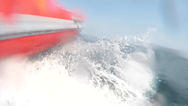 Small raft cruising across a rough ocean