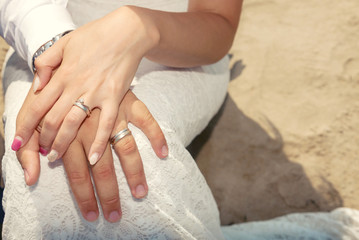 closeup of hands with rings