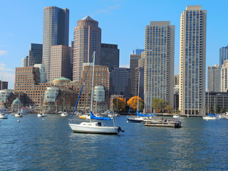 Fototapeta na wymiar A view of the Boston skyline with boats in the foreground.