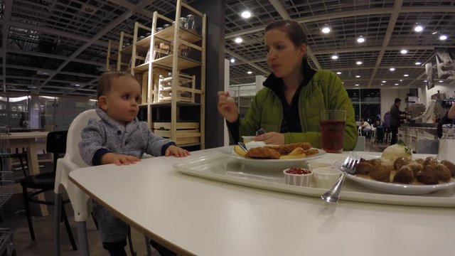 Family eating food at Swedish furniture store