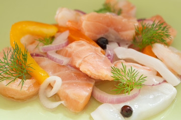 Marinated seafood - salmon fish, shrimp, and squid. Healthy seafood salad